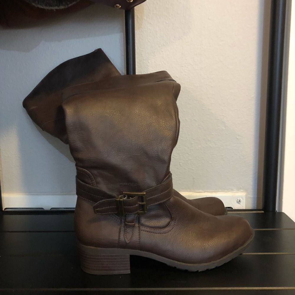 Brown knee high boots with tread
